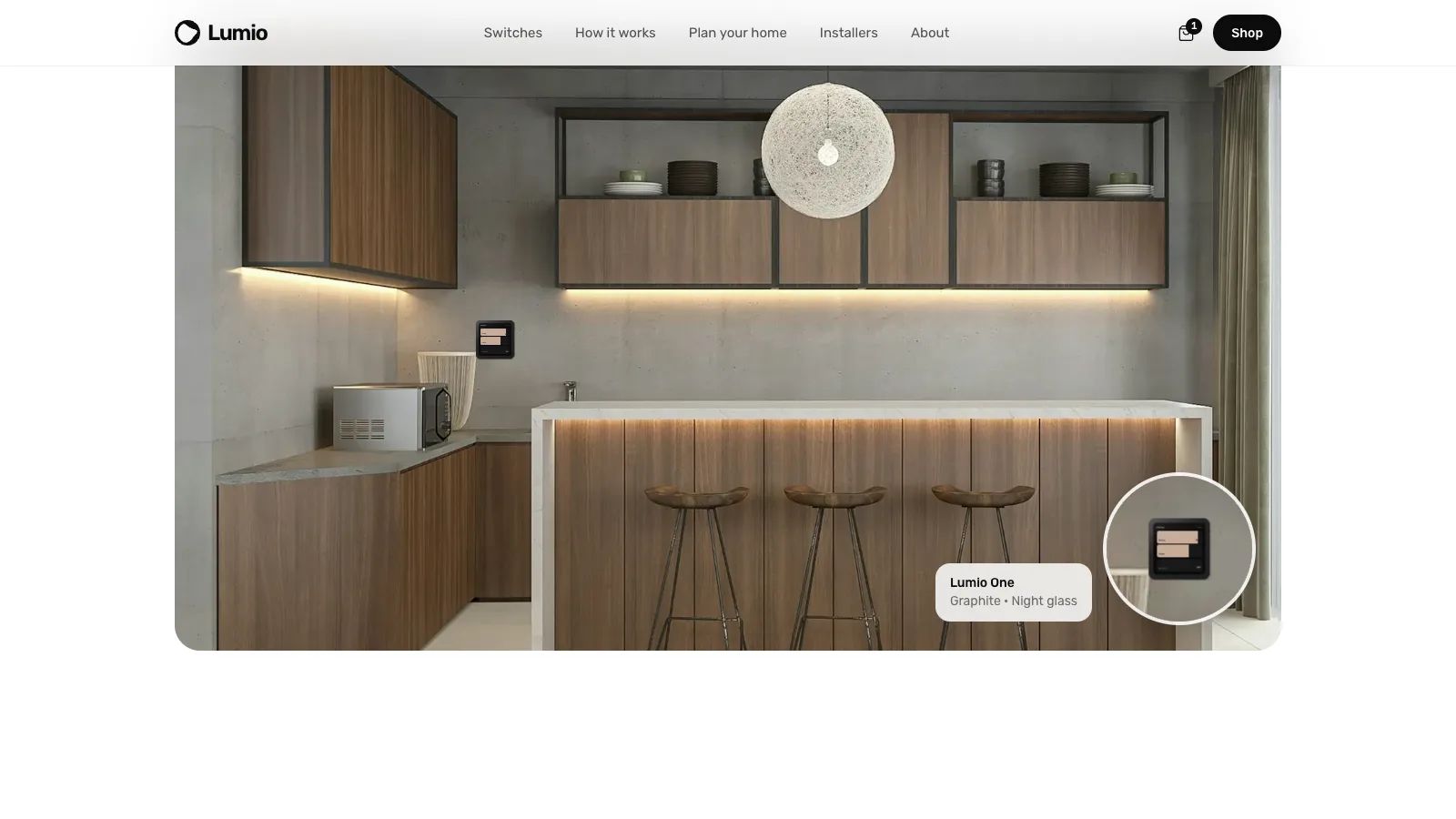 Lumio One in graphite on a concrete kitchen wall, with a detail loupe
